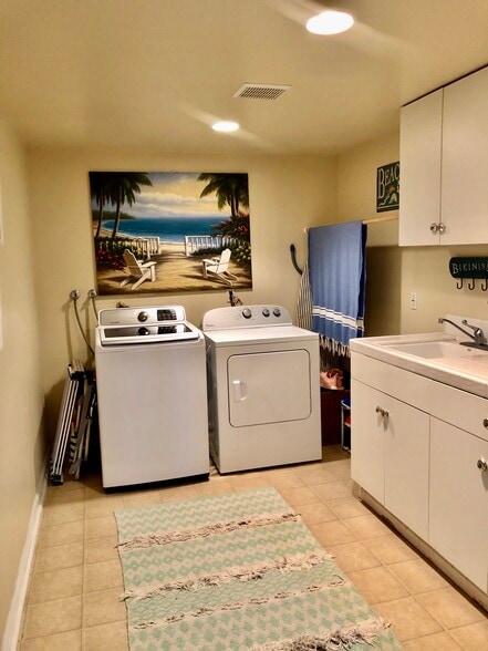 Washer and dryer/laundry room next to garage - 210 Whiting St