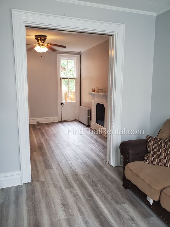 Building Photo - Charming Historic Retreat with Private Fenced Yard & Parking – Prime Downtown Location