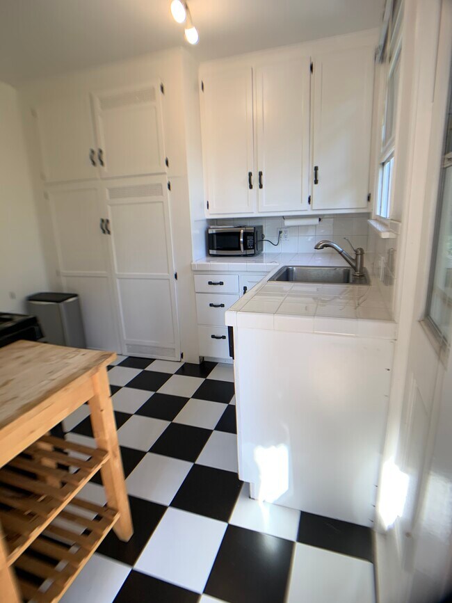Kitchen with Microwave and chopping table - 1827 18th St