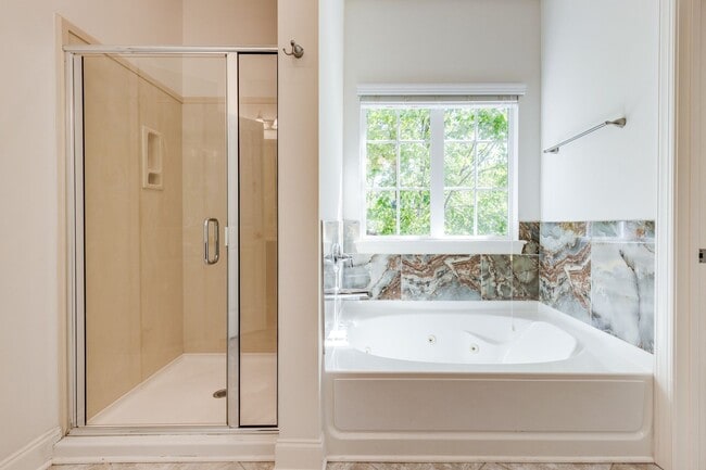 Building Photo - Welcome to this charming end unit townhome