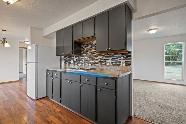 Building Photo - Post Falls Riverfront Home!