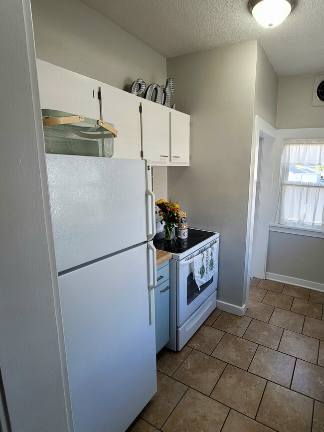 Full size fridge and electric stove - 1148 J Ave NW