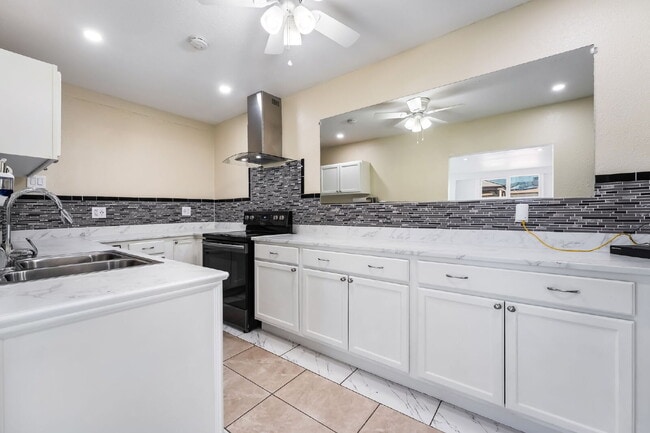 Building Photo - Single Story,  Totally Renovated , 3 bedroom, 2 bathroom Home with  extensive privacy and gated h...