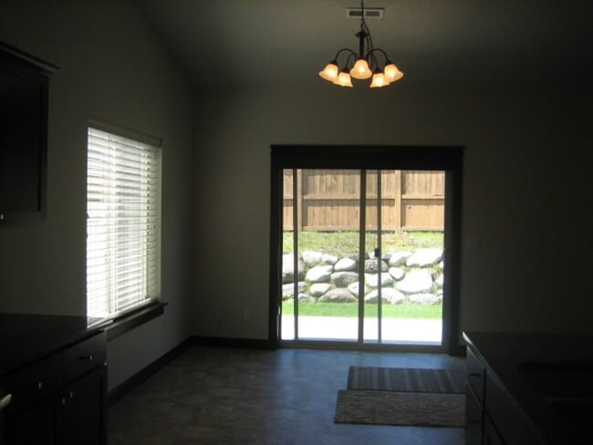 Building Photo - CDA Home w/ 22X45 RV Garage/Shop!