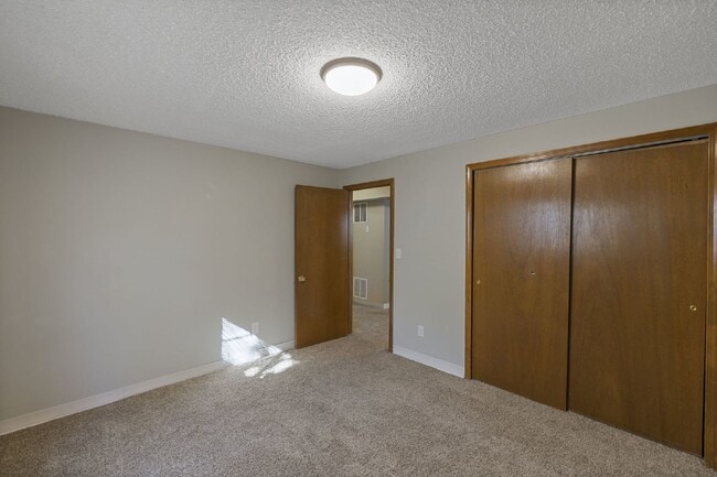 Building Photo - Spacious 4-Bedroom Home with Finished Basement, Large Deck & 2-Car Garage