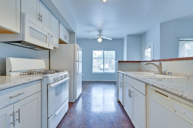 Building Photo - NW!! Gated!!! Clubhouse!!!Community Pool!!! 1st Floor Condo!!! Wood like floors!! No Carpet!!