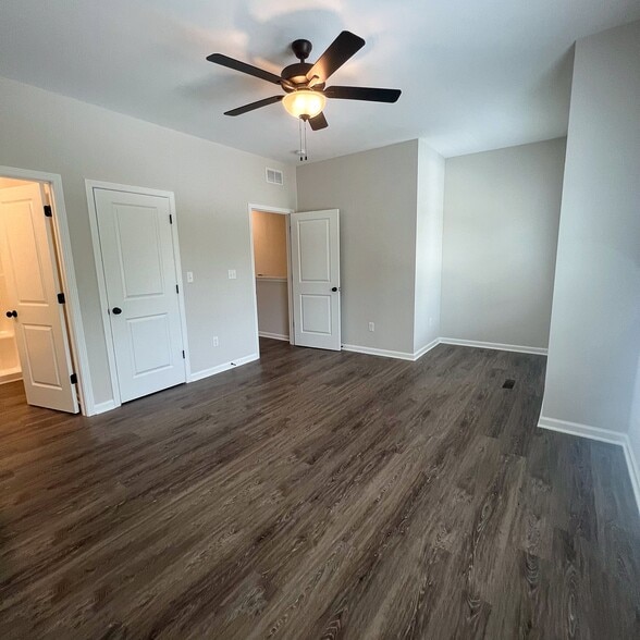 Spacious Bedroom One with private full bath, large closet, and natural light—your own comfortable re - 205 Cherry Way