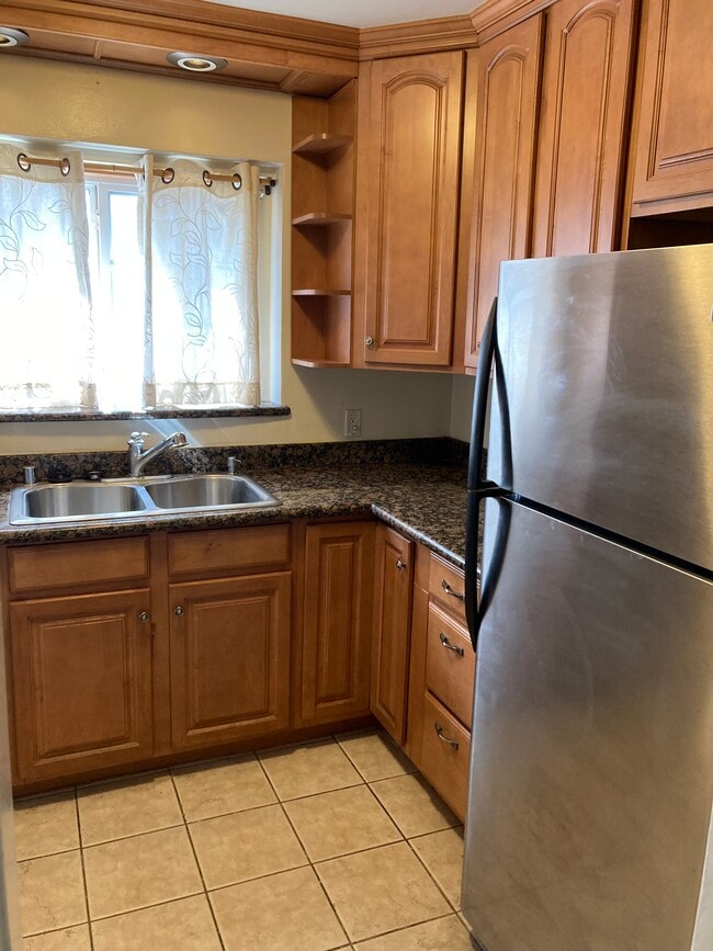 Kitchen as you walk in view - 4454 Laurelgrove Ave