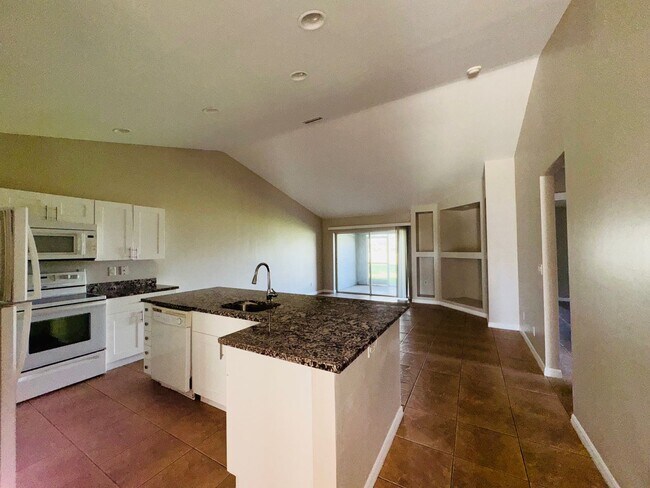 Building Photo - Experience this Cape Coral 3 bedroom 2 bath corner duplex with 1 car garage and screened in lanai.