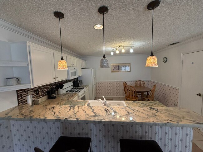 Building Photo - Delightful Turnkey Furnished, 2 bed, 2 Bath Patio Villa available for ANNUAL LEASE