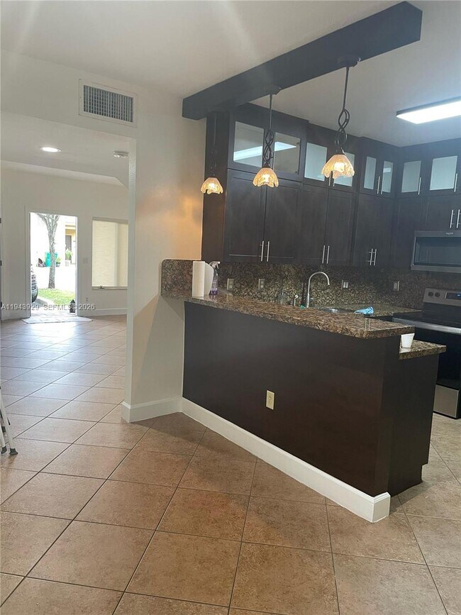 Building Photo - 11115 W Okeechobee Rd