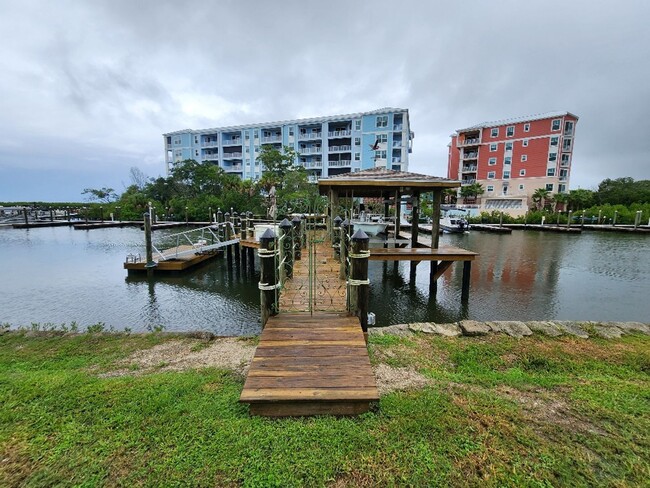 Building Photo - Gorgeous Riverfront 3/3 Saltwater Pool Hom...