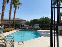 Building Photo - Three bedroom unit on the 2nd floor of gated SE community with pool/spa