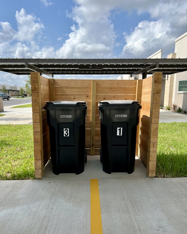 Individual trash bins - 3316 Duke Ave