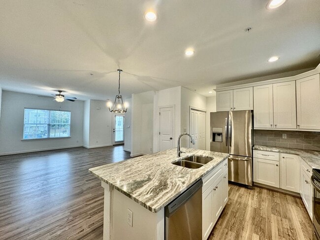 Building Photo - Practically New & Available NOW! Americana Luxury Townhomes! Pet Friendly! Attached Garage! All A...