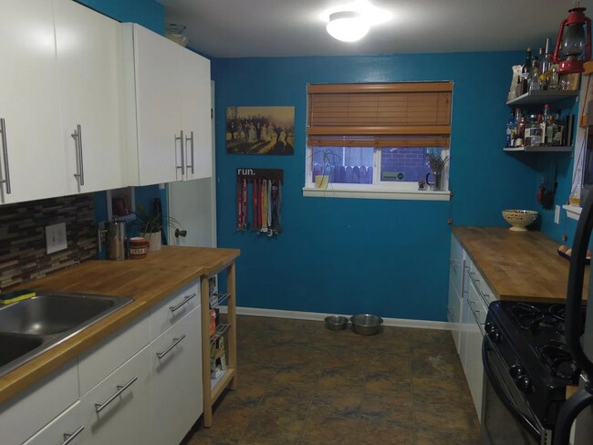 upstairs kitchen- walls now white - 4038 Kalamath St