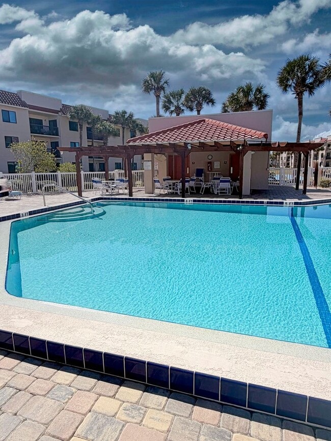 Building Photo - Beautifully Renovated, Fully Furnished Beach Condo just a short walk from the ocean.