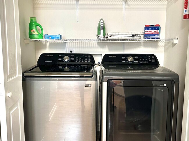 A washer and a dryer, iron, an ironing board, a fire extinguisher and a vacuum cleaner. - 6464 Starfish Cv