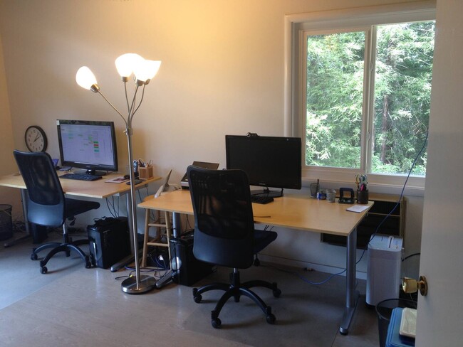 Study with doors to deck 2 desks, and built in library shelving - 5 Coronet Way