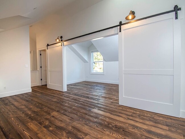 Building Photo - Expansive Loft-Style Carriage House in Private Haller Lake Estate