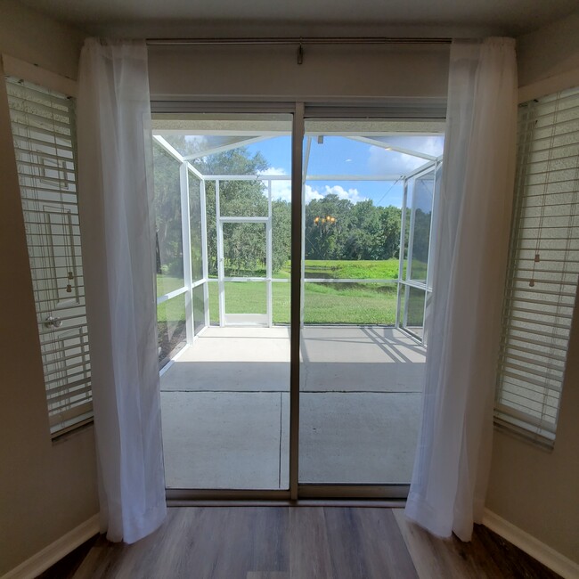 Slider leading to screened in lanai - 5808 Fishhawk Ridge Dr