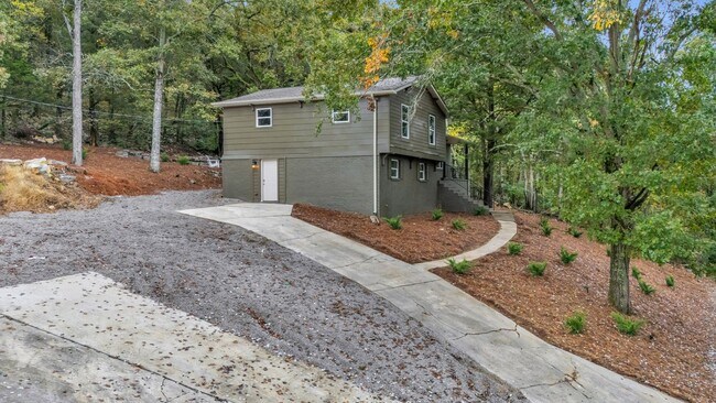 Building Photo - Retreat Like Feel + Practically New! 4 Beds, 3 Baths, Over 2,000 Sq Ft. with Glimpses of Nickajac...