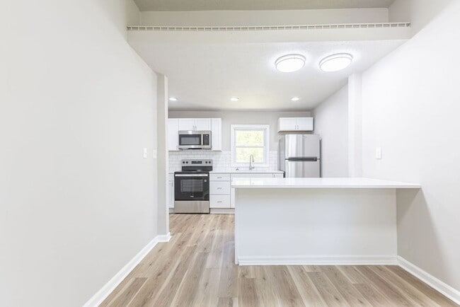 Building Photo - Remodeled 2-Bedroom Bungalow with Spacious Yard & 1-Car Basement Garage
