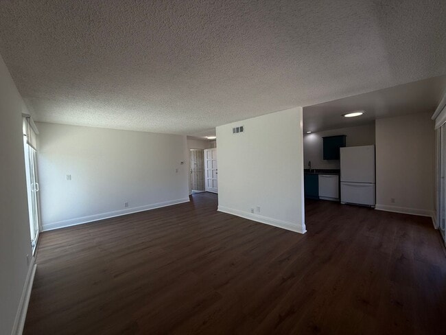 Building Photo - Recently updated home with new floors, paint & bathroom!
