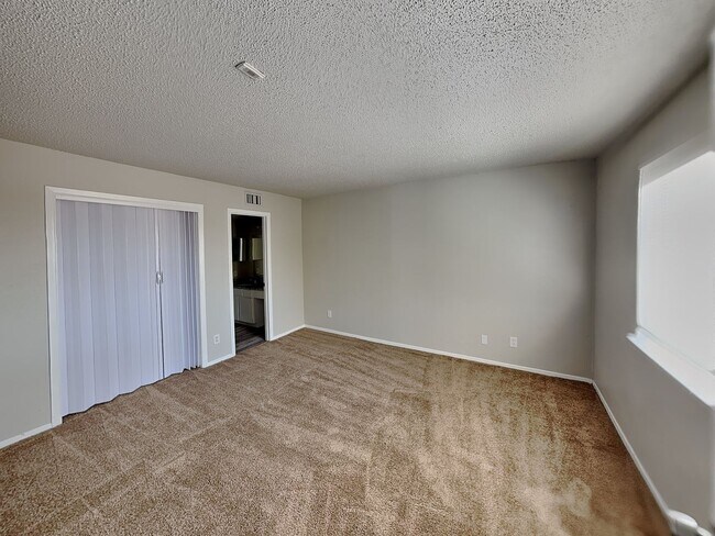 Building Photo - Stylish Upstairs Condo with Fireplace, Private Balcony & Gated Community Perks