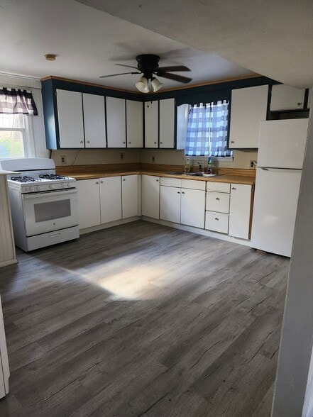 Large eat in kitchen, with new flooring & cabinet fronts. Has newer refrigerator & stove - 30 Glendale Ave