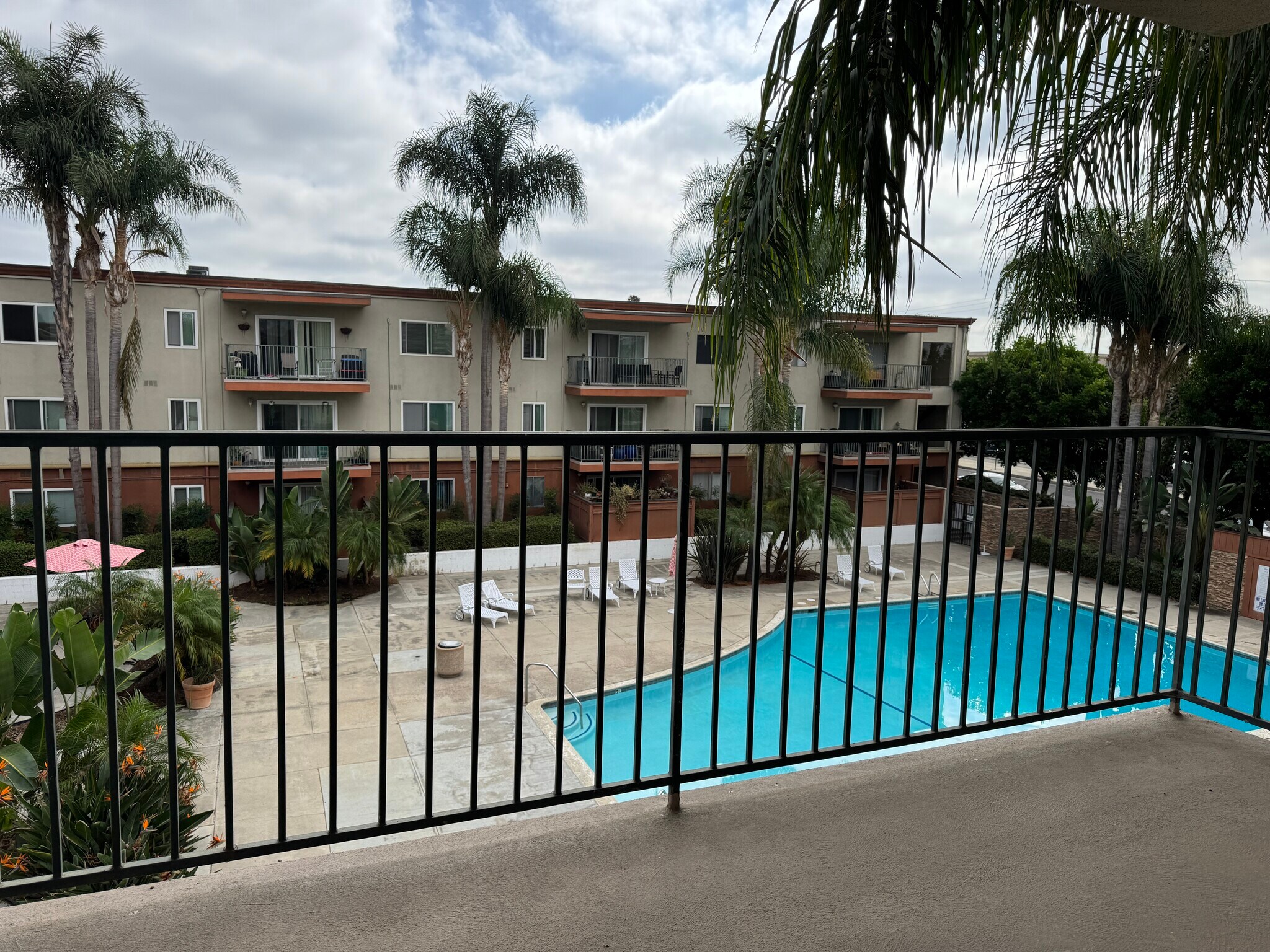 Living room patio view of pool - 400 N Acacia Ave