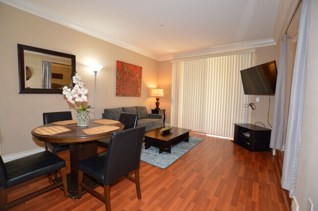 Building Photo - Meridian STUDIO Condo Fully Furnished w/Main Pool View-Lush Green trees in Resort Style Community.