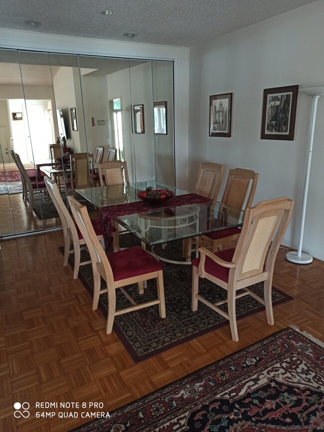 Dining room with mirrored cabinets - 106 Siena Way