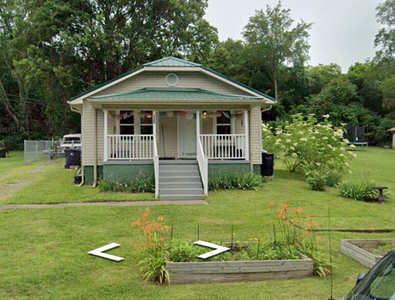 Front of house with two raised beds - 1509 Layman St
