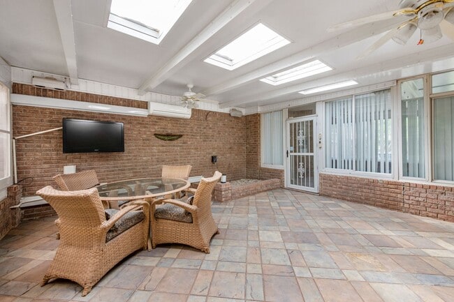 Building Photo - Spacious 3BR Retreat with Soaring Ceilings & Screened Porch