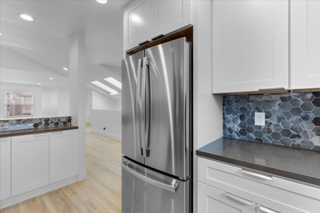 Building Photo - COMPLETELY REMODELED, BRIGHT & AIRY, TRI-LEVEL HOME W/ TOP-FLOOR GREAT ROOM LIVING SPACE, 2-CAR G...