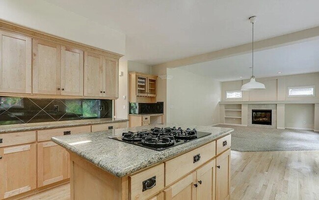 Building Photo - Spacious Four-Bedroom Home with Gourmet Kitchen, Multiple Living Areas, Loft, and Beautifully Lan...
