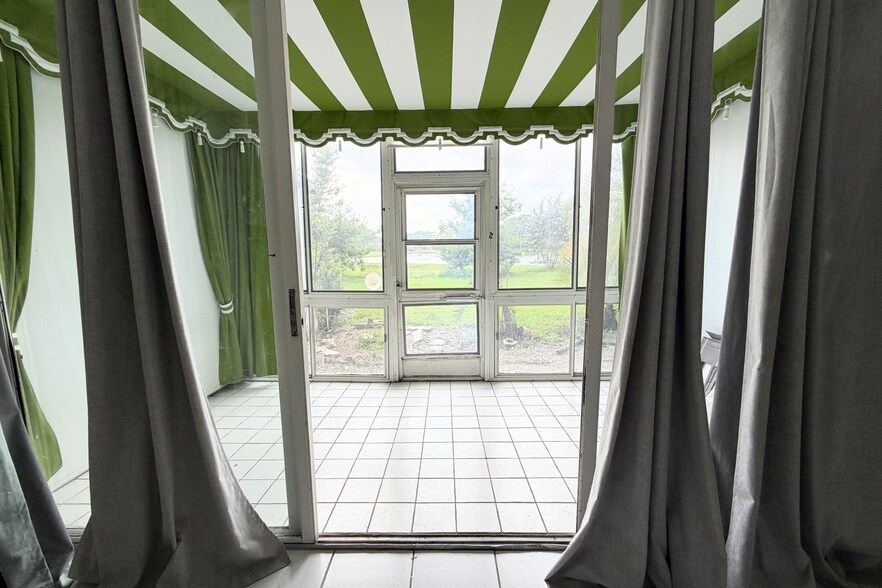 Screened patio, outside door, lake view. - 4266 Deste Ct