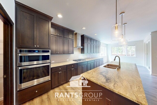 Building Photo - Luxury 4-Bedroom Home with 5-Car Garage & ...