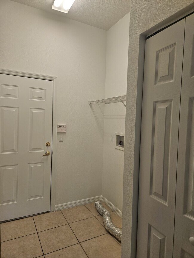 Building Photo - 4 BEDROOM 3 FULL BATH HOME WITH A SCREENED IN POOL IN THE BEAUTIFUL PALM COAST