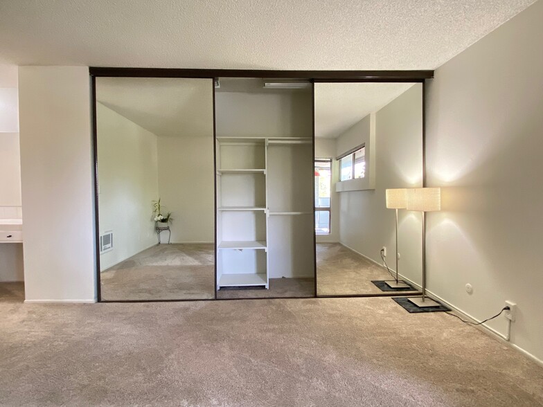 Mirrored closet with built-in shelves - 355 S Los Robles Ave