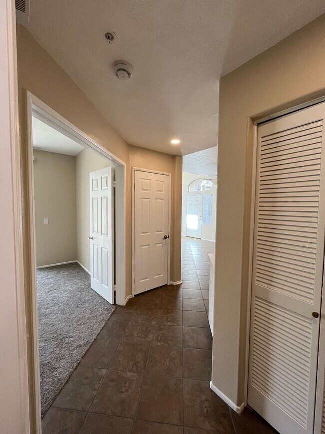 Building Photo - PICTURE PERFECT!  3 BR/3 BA END UNIT CONDO with DIRECT ACCESS 2 CAR GARAGE