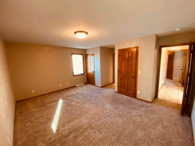 Master bedroom with walk in closets - N1125 Craftsmen Ct