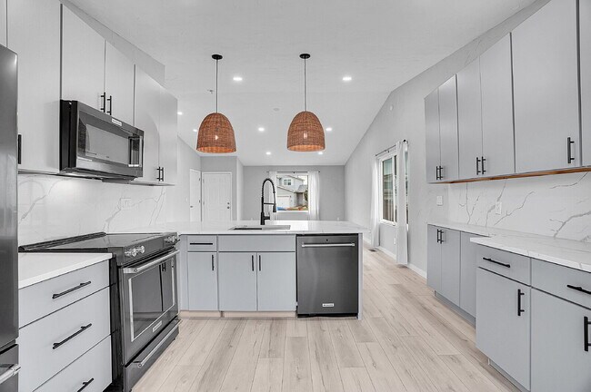 Building Photo - $3,295.95 - 3 bed, 2 bath updated Home in Littleton with Two Full Kitchens and Impressive Yard!