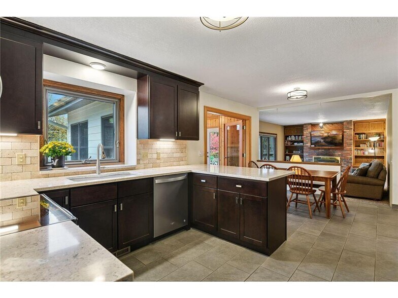 Remodeled kitchen with stainless appliances - 9933 Balmoral Ln