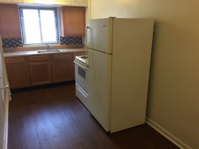 kitchens vary - all have white appliances and new vinyl flooring - 104 Lewiston Rd