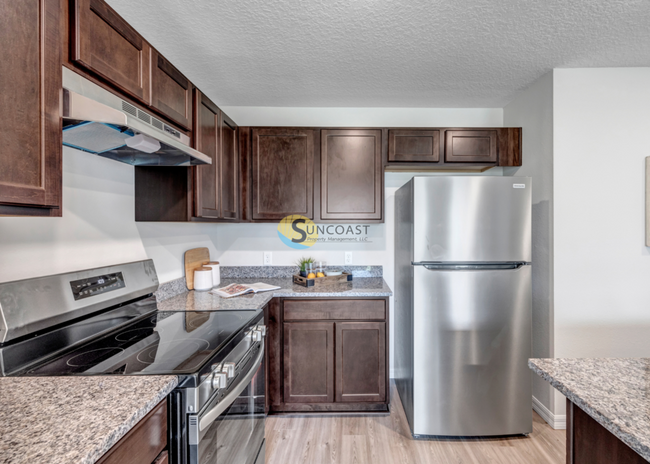 Building Photo - Gift Card Giveaway for this Corner Unit!