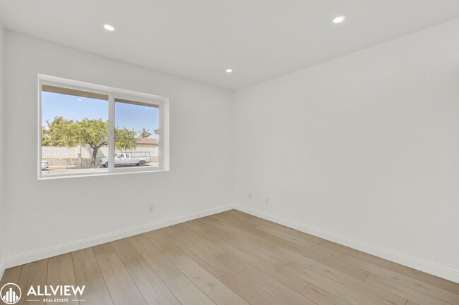 Building Photo - Fully Renovated 4-Bedroom Home with Firepl...