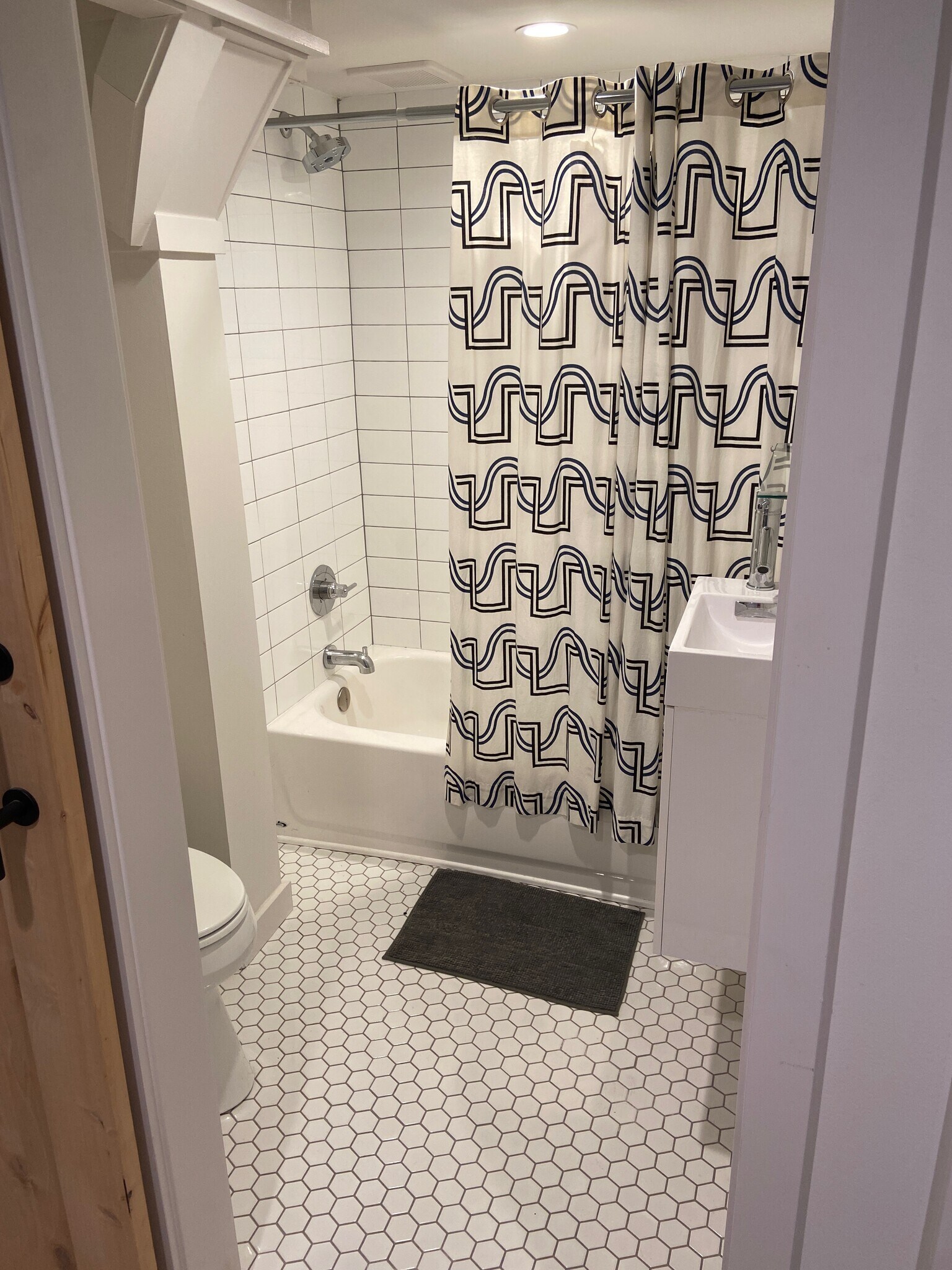 both (full) bathrooms finished with gorgeous tile, handles and light fixtures. - 5124 NE 35th Pl