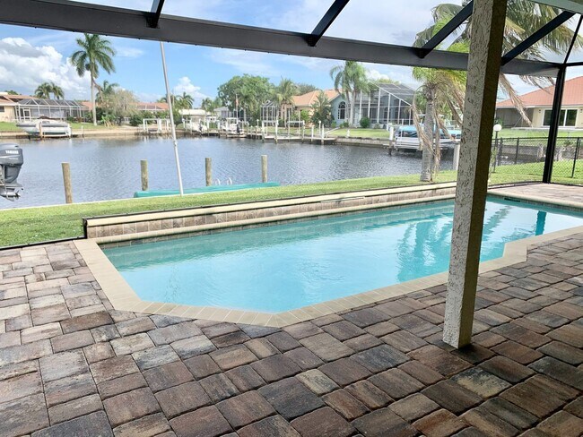 Building Photo - AVAILABLE 2027 SEASON! ! PGI HEATED POOL, WATERFRONT, BOAT LIFT